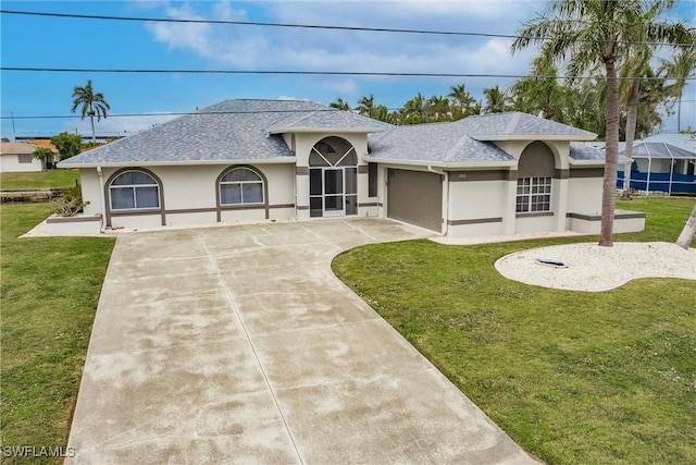 view of front facade featuring a front lawn and a garage