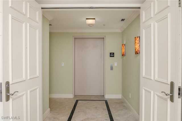 doorway to outside featuring ornamental molding and light tile patterned flooring