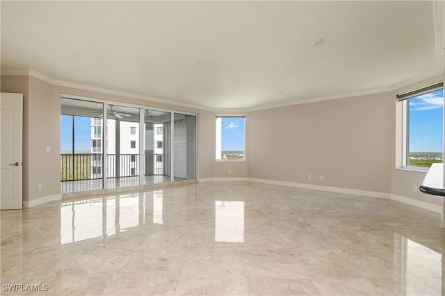 empty room with ceiling fan and crown molding