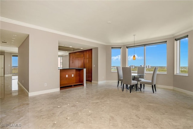 dining space with ornamental molding