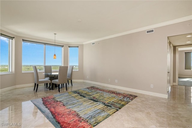 dining room with crown molding