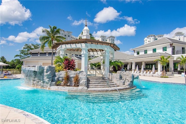 view of pool with pool water feature and a gazebo