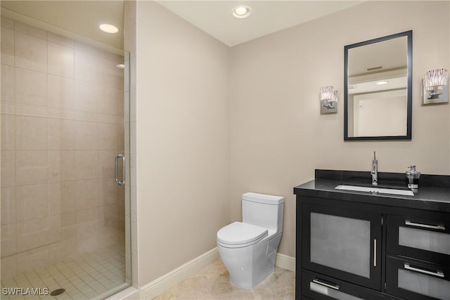 bathroom with a shower with door, tile patterned floors, toilet, and vanity