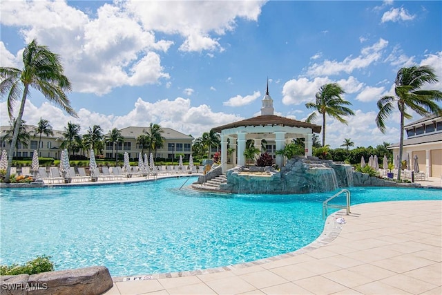 view of pool with a gazebo, pool water feature, and a patio