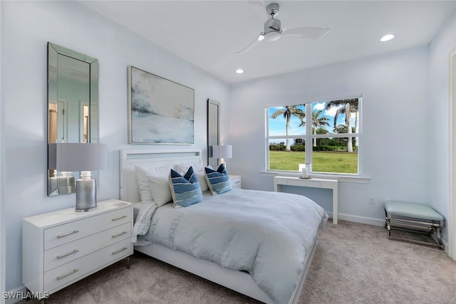 bedroom featuring light carpet and ceiling fan