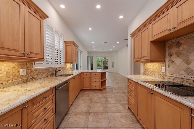 kitchen featuring kitchen peninsula, light stone countertops, sink, stainless steel dishwasher, and light tile patterned floors