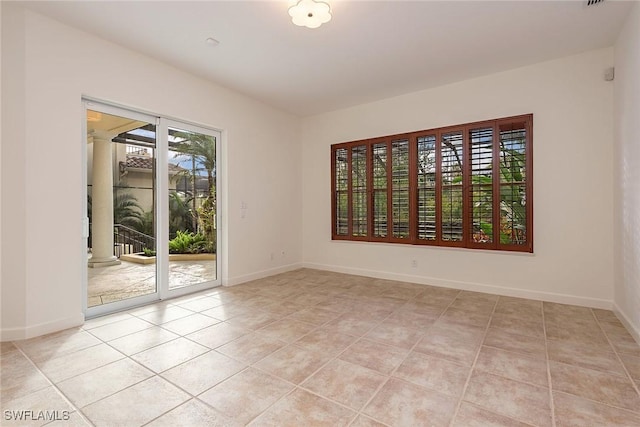 view of tiled spare room