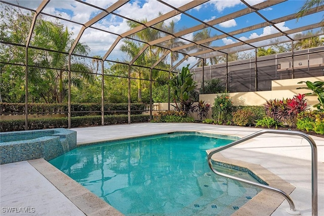 view of swimming pool featuring a patio area, an in ground hot tub, and a lanai