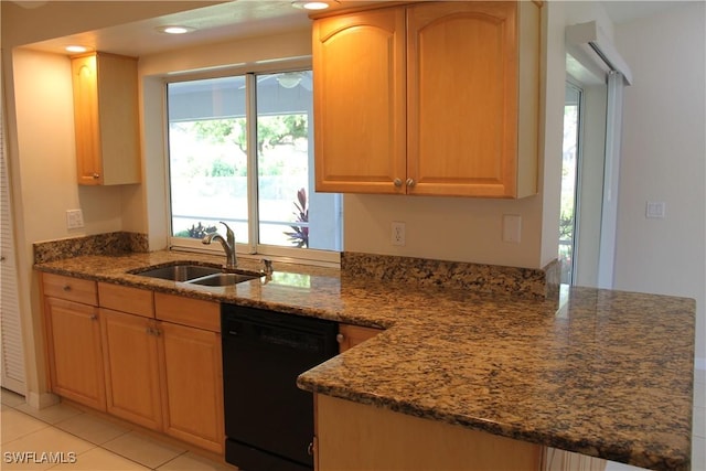 kitchen featuring sink, dark stone countertops, light tile patterned floors, and black dishwasher