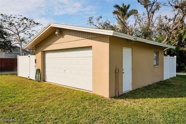 garage with a yard