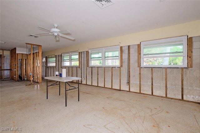 basement featuring ceiling fan