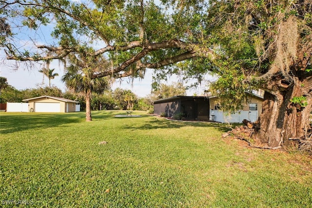 view of yard featuring a garage