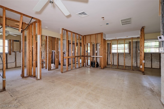 interior space with ceiling fan