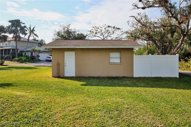 view of outdoor structure with a yard