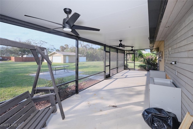 sunroom / solarium featuring ceiling fan and plenty of natural light