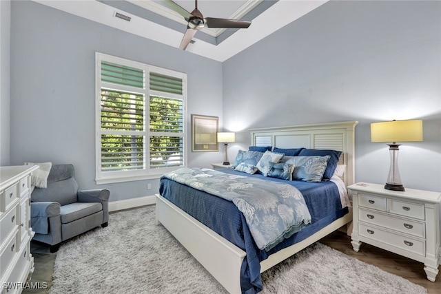 bedroom with ceiling fan, ornamental molding, and lofted ceiling