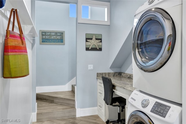 laundry area with stacked washer and dryer