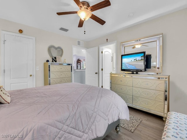 bedroom featuring ceiling fan and wood-type flooring