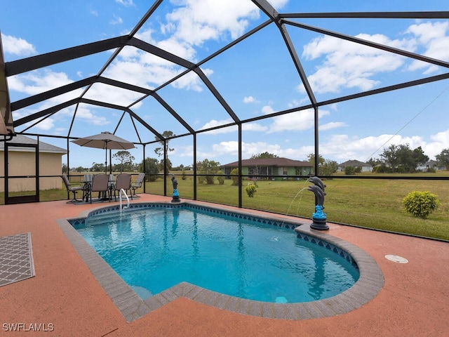 view of pool with a lanai, a lawn, and a patio