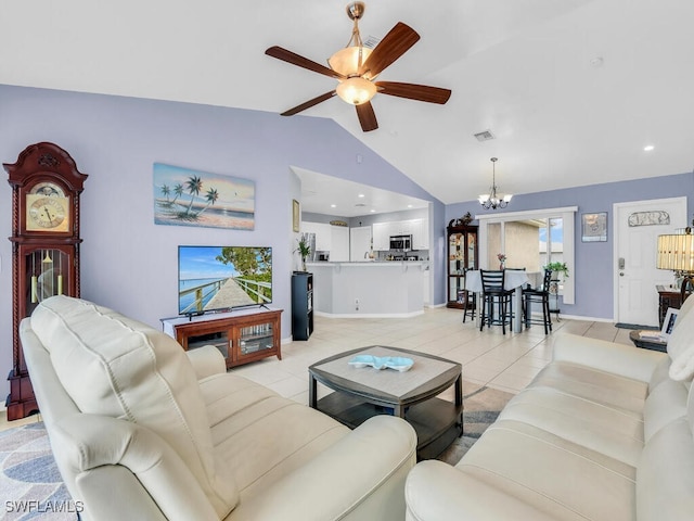 tiled living room featuring lofted ceiling and ceiling fan with notable chandelier