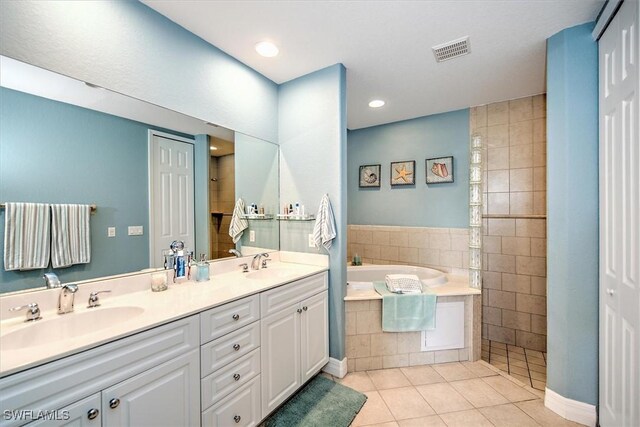 bathroom with vanity, shower with separate bathtub, and tile patterned flooring