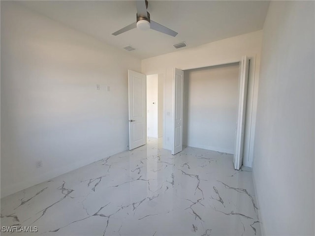 unfurnished bedroom featuring a closet and ceiling fan