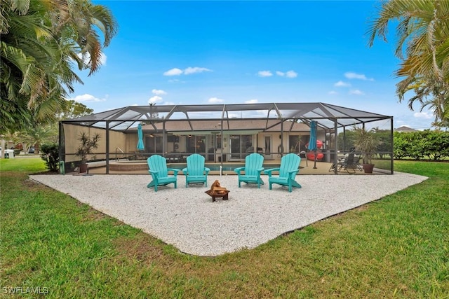 view of patio with a fire pit and glass enclosure