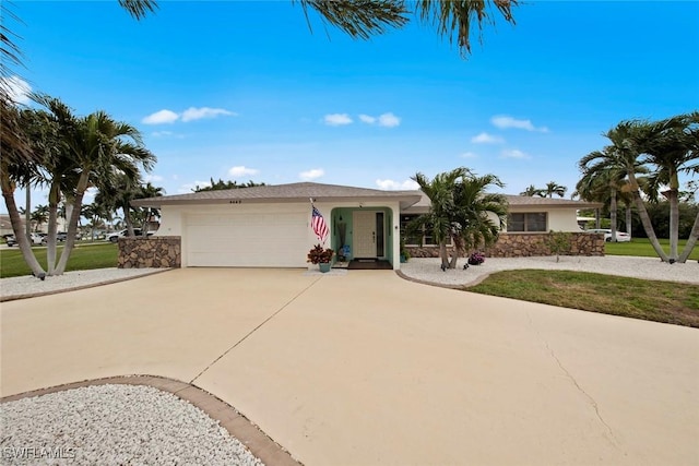 single story home featuring a front yard and a garage