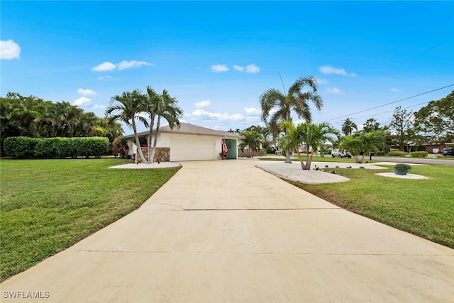 view of front facade featuring a garage and a front yard