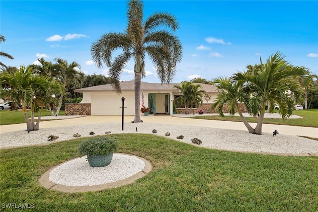 view of front of property featuring a garage and a front lawn