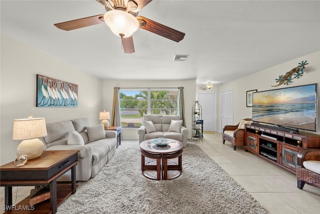 tiled living room featuring ceiling fan