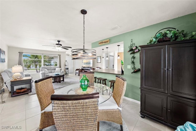 dining room featuring ceiling fan and light tile patterned floors