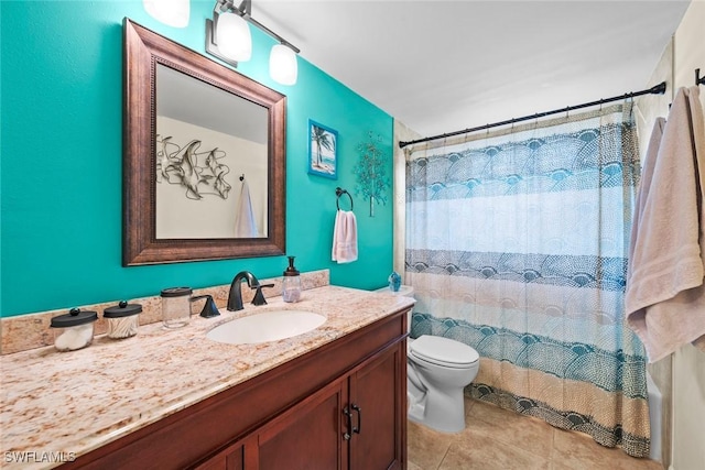 bathroom featuring toilet, vanity, and walk in shower