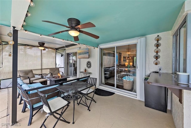 view of patio / terrace with an outdoor fire pit