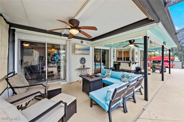 view of patio / terrace with an outdoor living space with a fire pit