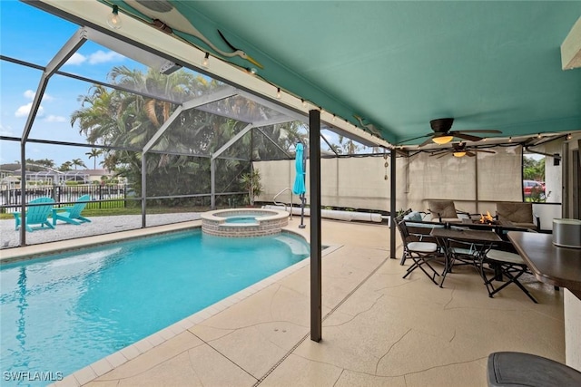 view of pool with glass enclosure, an in ground hot tub, and a patio