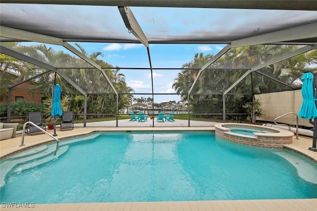 view of pool with an in ground hot tub, a lanai, and a patio area