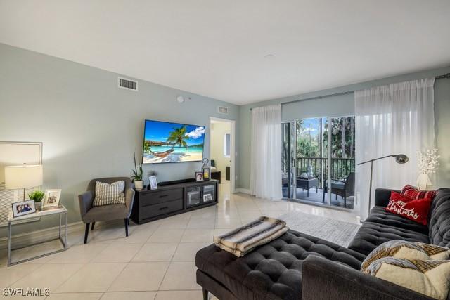 living room with light tile patterned floors