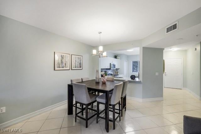 dining room with light tile patterned flooring