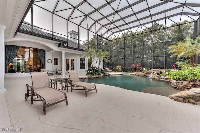 view of swimming pool with a lanai and a patio