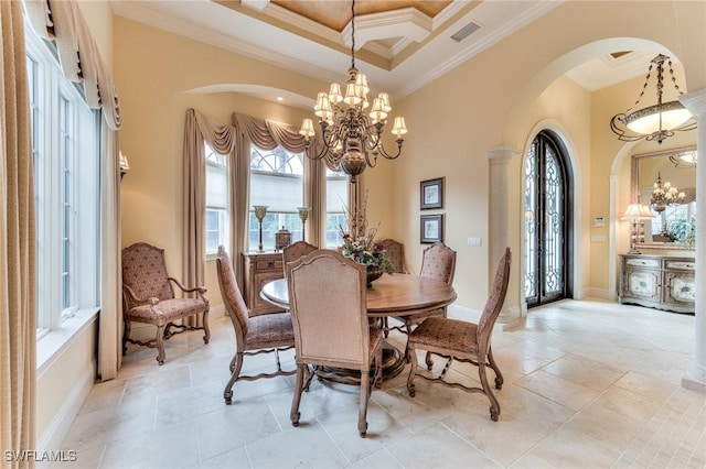 dining area with coffered ceiling, a towering ceiling, an inviting chandelier, and ornamental molding