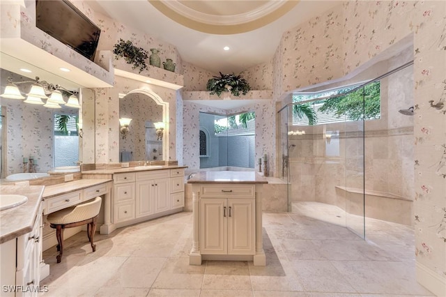 bathroom with a towering ceiling, vanity, tiled shower, a tray ceiling, and crown molding