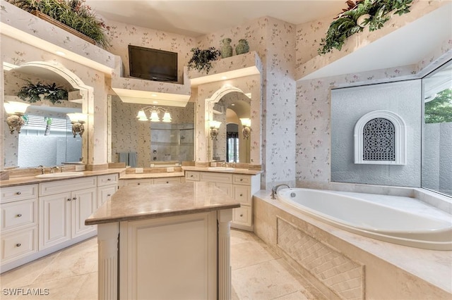 bathroom featuring vanity, tile patterned floors, and shower with separate bathtub