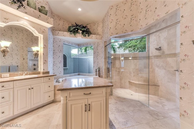 bathroom featuring vanity and tiled shower