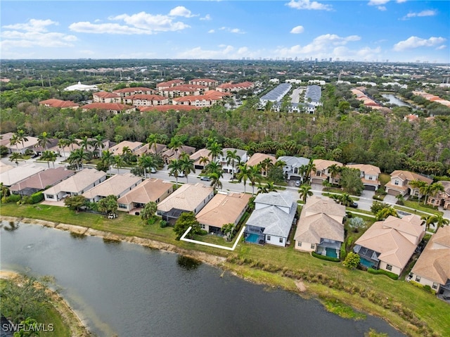 bird's eye view featuring a water view and a residential view