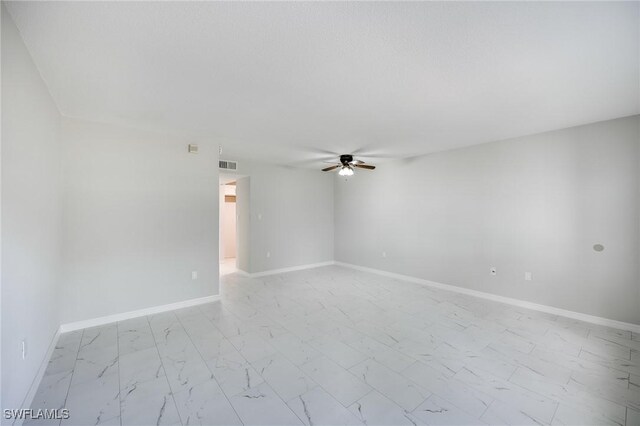 unfurnished room featuring ceiling fan