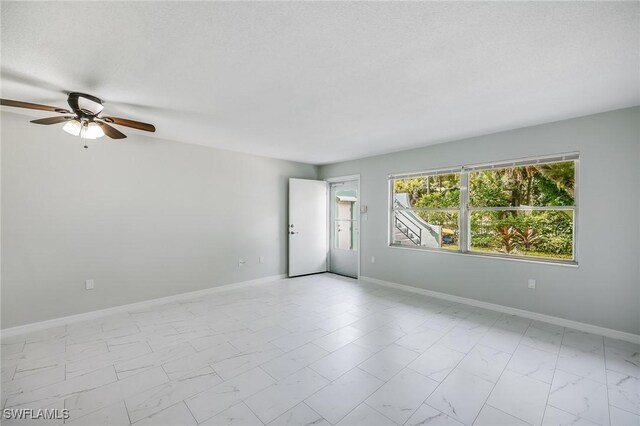 spare room featuring ceiling fan