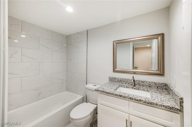 full bath featuring toilet, bathtub / shower combination, and vanity