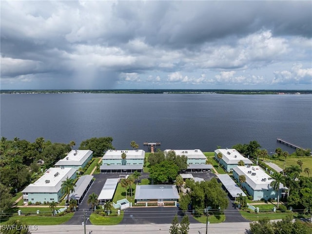 birds eye view of property with a water view