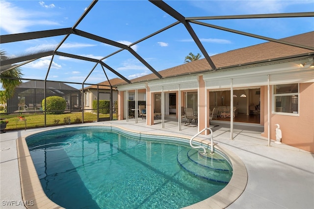 view of pool with a lanai and a patio